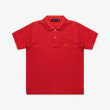 Flat lay of the red polo shirt, showing the front with the gold embroidered logo on the chest and buttoned collar.