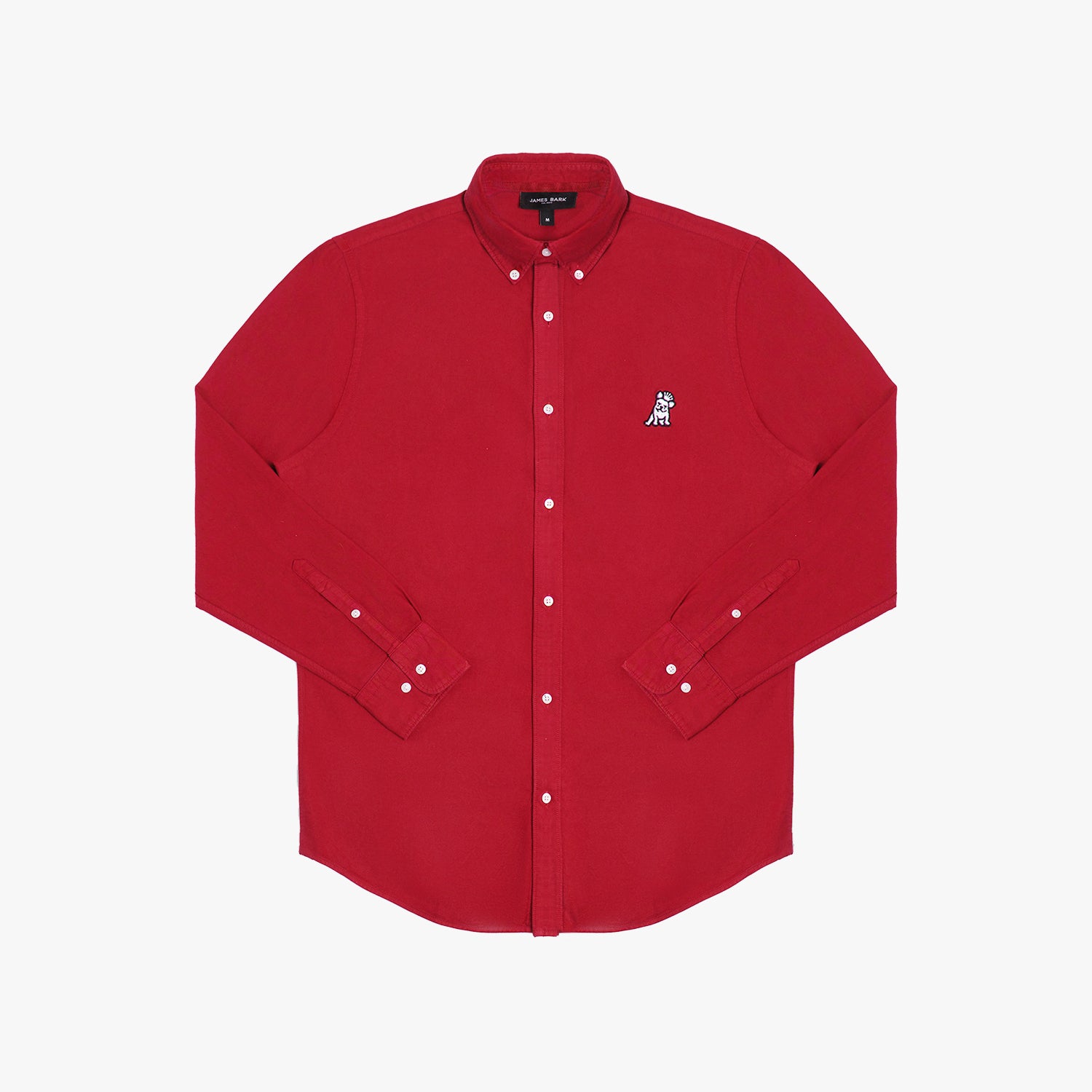 Flat lay photograph of a red long-sleeve button-down oxford shirt with a small white embroidered logo on the left chest and a visible brand label inside the collar, against a white background