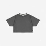 A dark gray short-sleeve crop top t-shirt with 'JAMES BARK ELEMENTS' printed in light gray on the left chest, displayed flat.