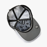 An overhead view of a gray snapback cap with a black brim, black mesh back panels, and a black adjustable strap. 