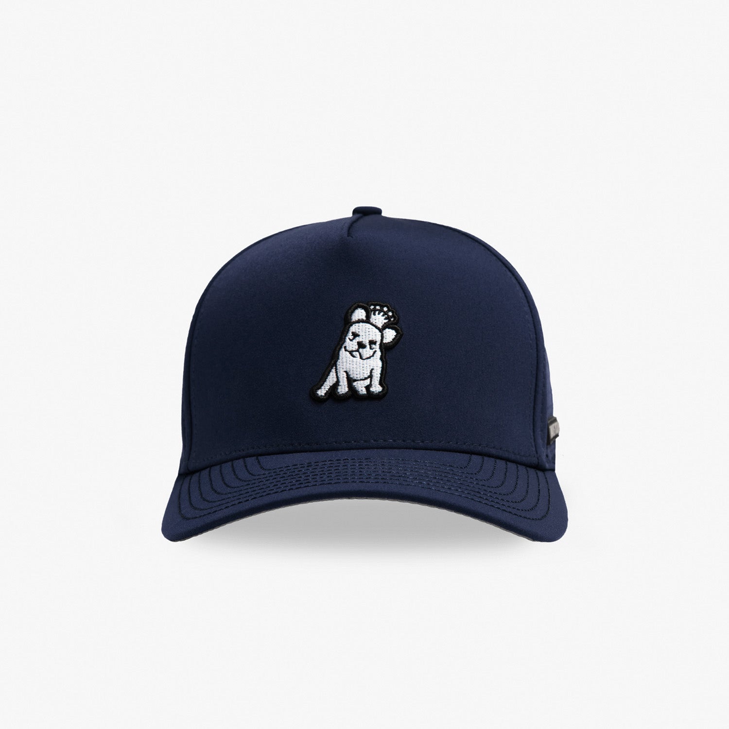 A navy blue baseball cap featuring a small embroidered dog patch on the front