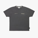A dark gray T-shirt by James Bark Elements, featuring small white text logos on the left chest, displayed flat