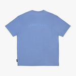 A light blue T-shirt shown from the back, featuring a tonal, slightly darker blue 'JAMES BARK ELEMENTS' logo printed across the upper back, displayed flat.