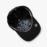 Black structured baseball cap with a curved brim, featuring a gray and black graphic pattern on the underside of the brim and a circular silver logo on the side