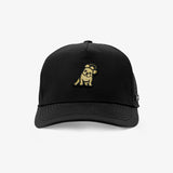 A black baseball cap with a small embroidered cartoon dog patch on the front