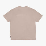 A light beige short-sleeve T-shirt shown from the back, featuring a tonal, slightly darker 'JAMES BARK' logo printed across the upper back.