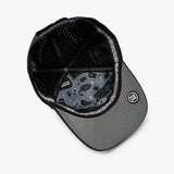 A black and gray baseball cap shown from an overhead angle, featuring a black mesh back, a gray visor with a subtle geometric pattern, and a circular patch on the side.
