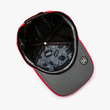 An overhead view of a structured baseball cap with a red and gray color-blocked design.