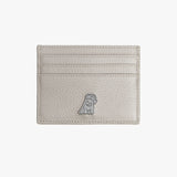 A front view of a gray leather cardholder with a pebbled texture. The design features a small silver embossed dog logo at the bottom, along with multiple card slots for added utility.