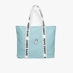 Blue tote bag with a white dog logo embroidered on the front. The bag has white handles with 'James Bark' printed in black along the straps.