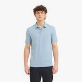 Man wearing a light blue polo shirt on a white background