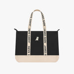 Black tote bag with beige accents and 'James Bark' branding on a white background