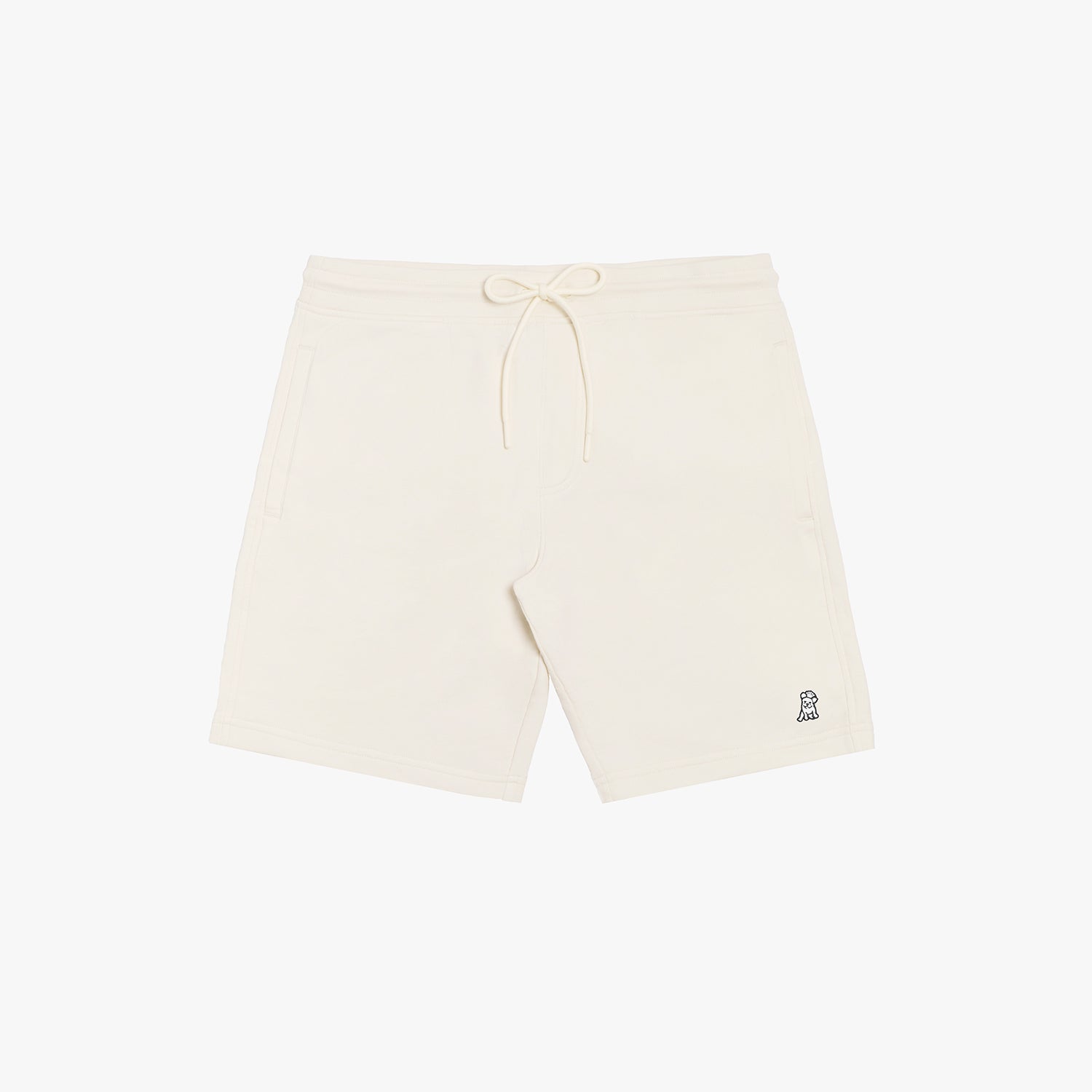 Flat-lay front view of cream-colored shorts featuring a minimalist design with a drawstring waistband and a small embroidered logo.