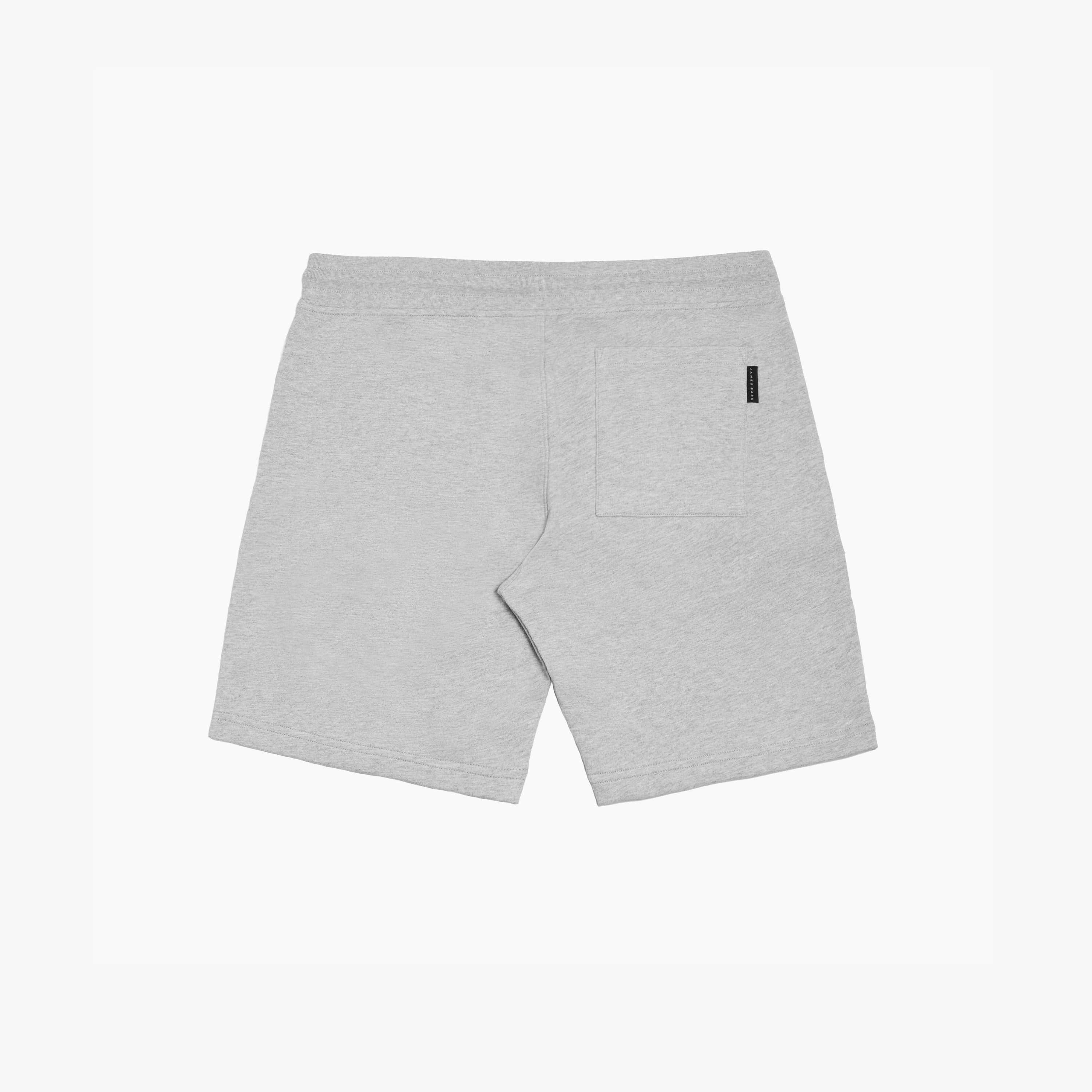 Flat-lay back view of gray shorts, featuring a single back pocket with a subtle brand tag and a clean, minimalistic design