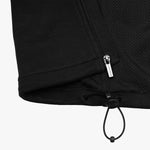 A close-up of the jacket’s bottom hem, showing the drawstring adjustment.