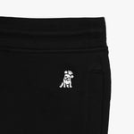 Close-up of the embroidered dog logo on the black jogger pants near the waistband, showcasing fine stitching.