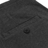 A close-up of the back pocket with a button, highlighting the fabric texture and pocket detailing.