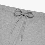 Close-up detail of light gray jogger-style sweatpants showcasing the drawstring tied in a bow at the waistband. The sweatpants are displayed against a plain white background." Let me know if you'd like any adjustments