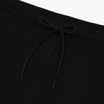 Close-up of the black drawstring waistband on the jogger pants