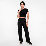 Woman wearing a black outfit on a white background