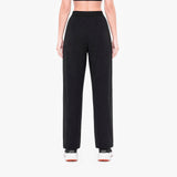 Person wearing black high-waisted pants on a white background