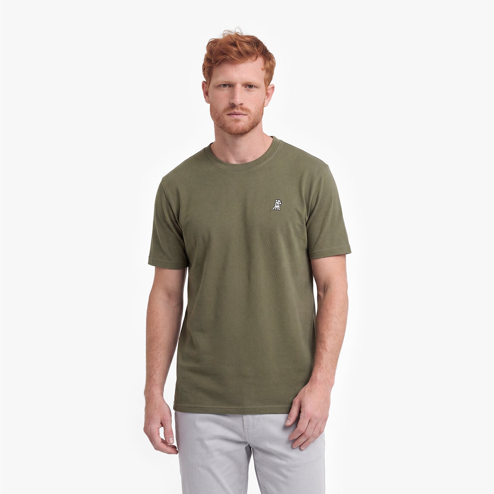 Man wearing a green t-shirt on a white background
