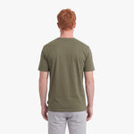 Back view of a man wearing a green t-shirt on a white background