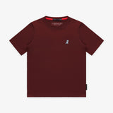 Flat-lay front view of the maroon t-shirt showing the small white embroidered logo on the chest.