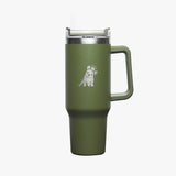 An olive-green insulated travel mug with a sturdy handle, a silver dog logo printed on the front, and a stainless steel rim with a clear lid featuring a built-in straw.