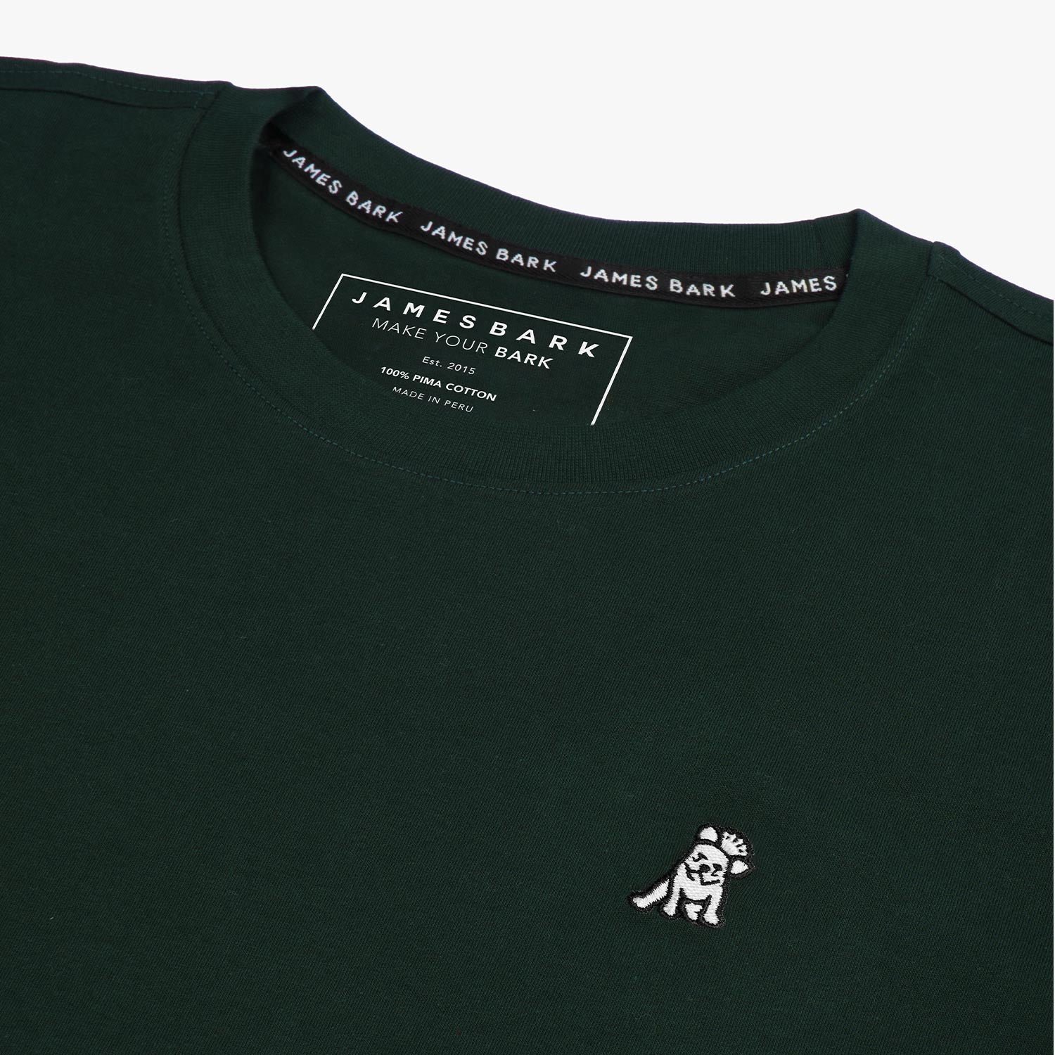 Close-up of the collar and inner label of the black t-shirt, showing the brand information and neck design.