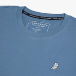 The blue t-shirt laid flat, showing the front of the shirt with the small embroidered animal logo on the left chest.