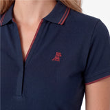 Close-up of a navy polo with a red embroidered dog logo