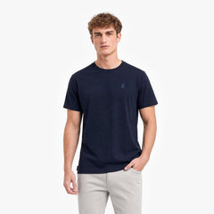Man wearing a navy blue t-shirt on a white background
