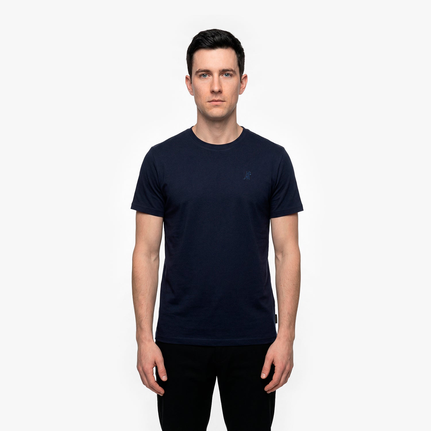 Man wearing a navy blue t-shirt on a white background