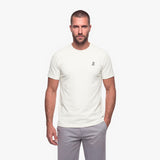 Man wearing a white t-shirt with a white embroidered logo on a white background