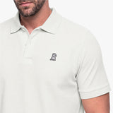 Light gray polo shirt with a small logo on the chest against a white background
