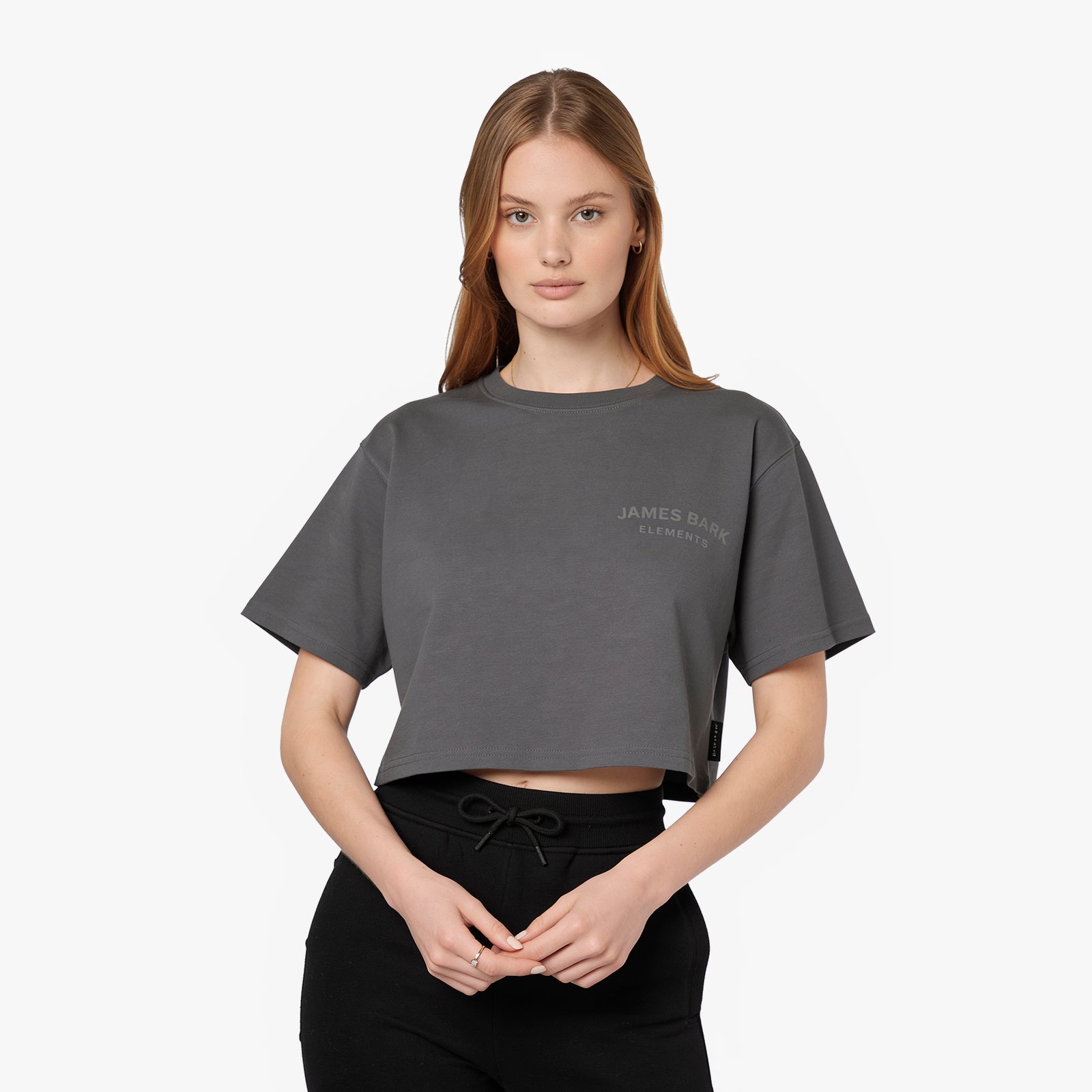 Female model wearing a grey James Bark Elements cropped t-shirt.