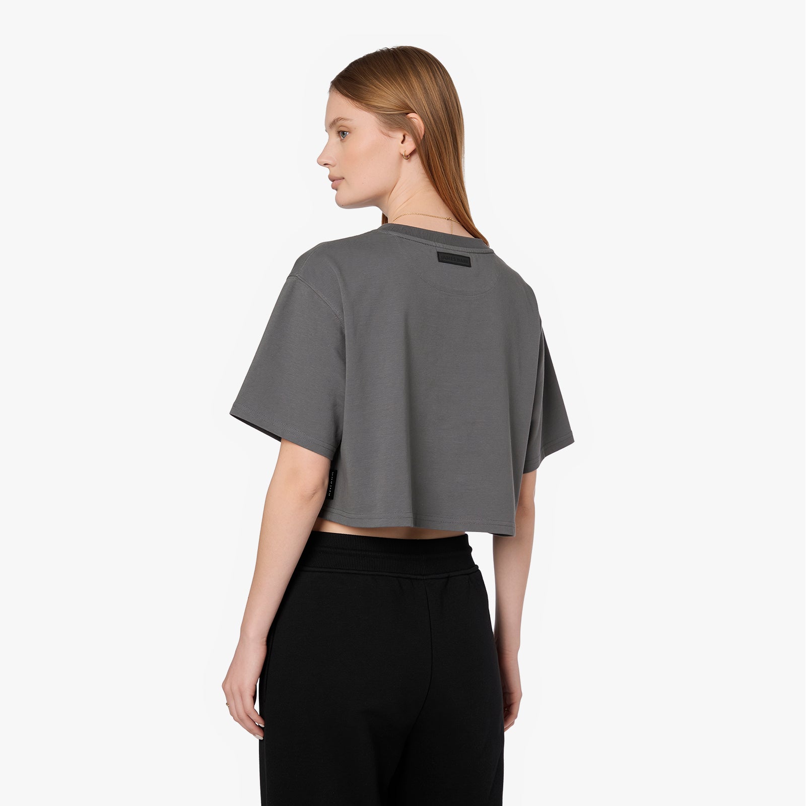 Back view of a woman wearing a grey James Bark Elements cropped t-shirt