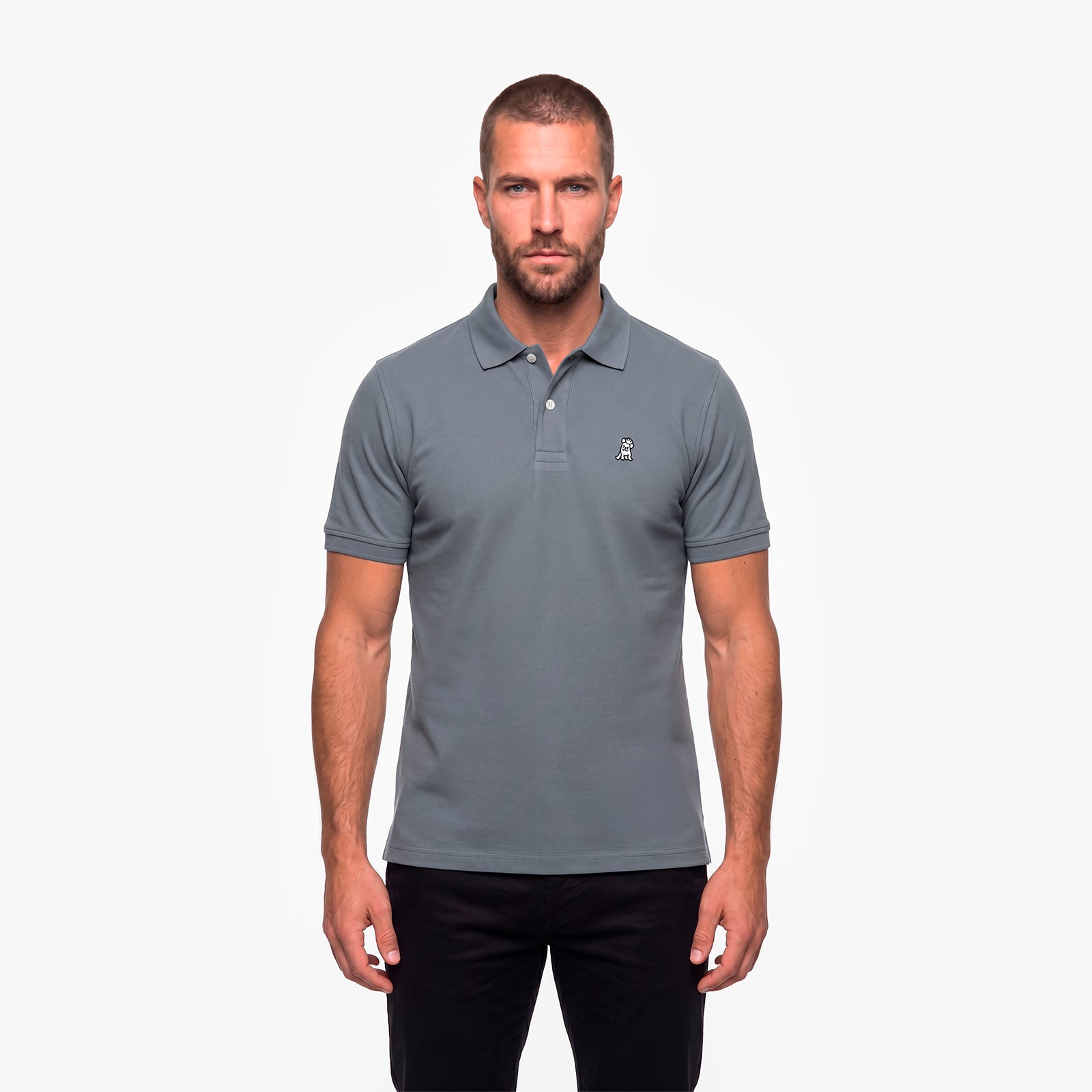 Man wearing a gray polo with a white embroidered logo on a white background