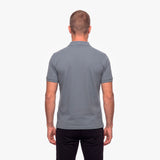 Man wearing a gray polo shirt on a white background