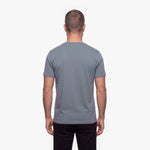Man wearing a gray t-shirt on a white background