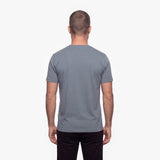 Man wearing a gray t-shirt on a white background