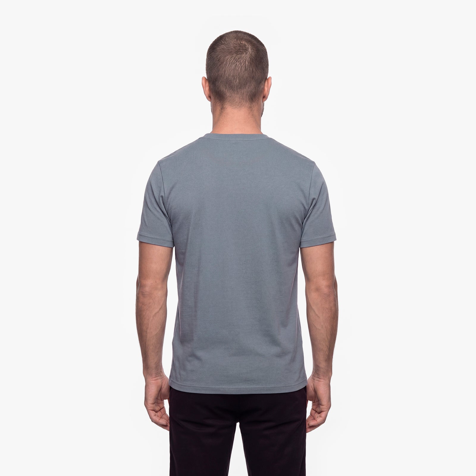 Man wearing a gray t-shirt on a white background
