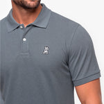 Gray polo shirt with a small logo on a white background