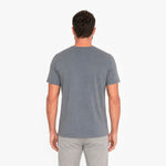 Man wearing a gray t-shirt on a white background