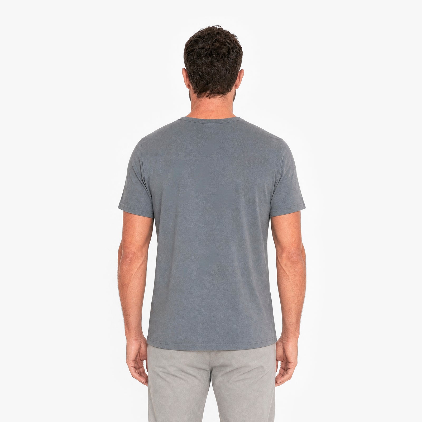 Man wearing a gray t-shirt on a white background