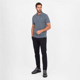 Man wearing a gray polo on a white background