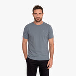 Man wearing a gray t-shirt on a white background
