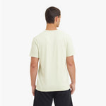 Man wearing a light-colored t-shirt on a white background