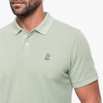 Light green polo shirt with a small logo on a white background
